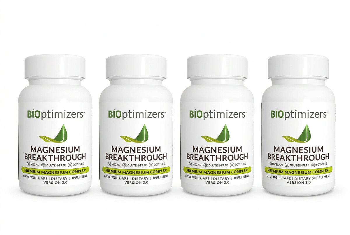 Four Magnesium Breakthrough bottles in a row on a white background